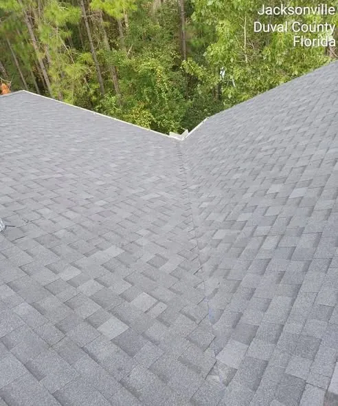 Clean shingle roof valley where two roof planes meet